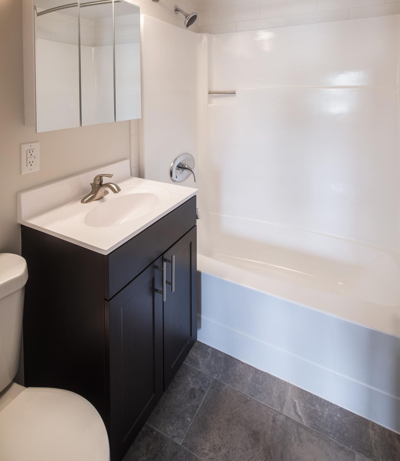 Uptown 550 Midrise spacious kitchen with custom cabinetry and stainless steel appliances