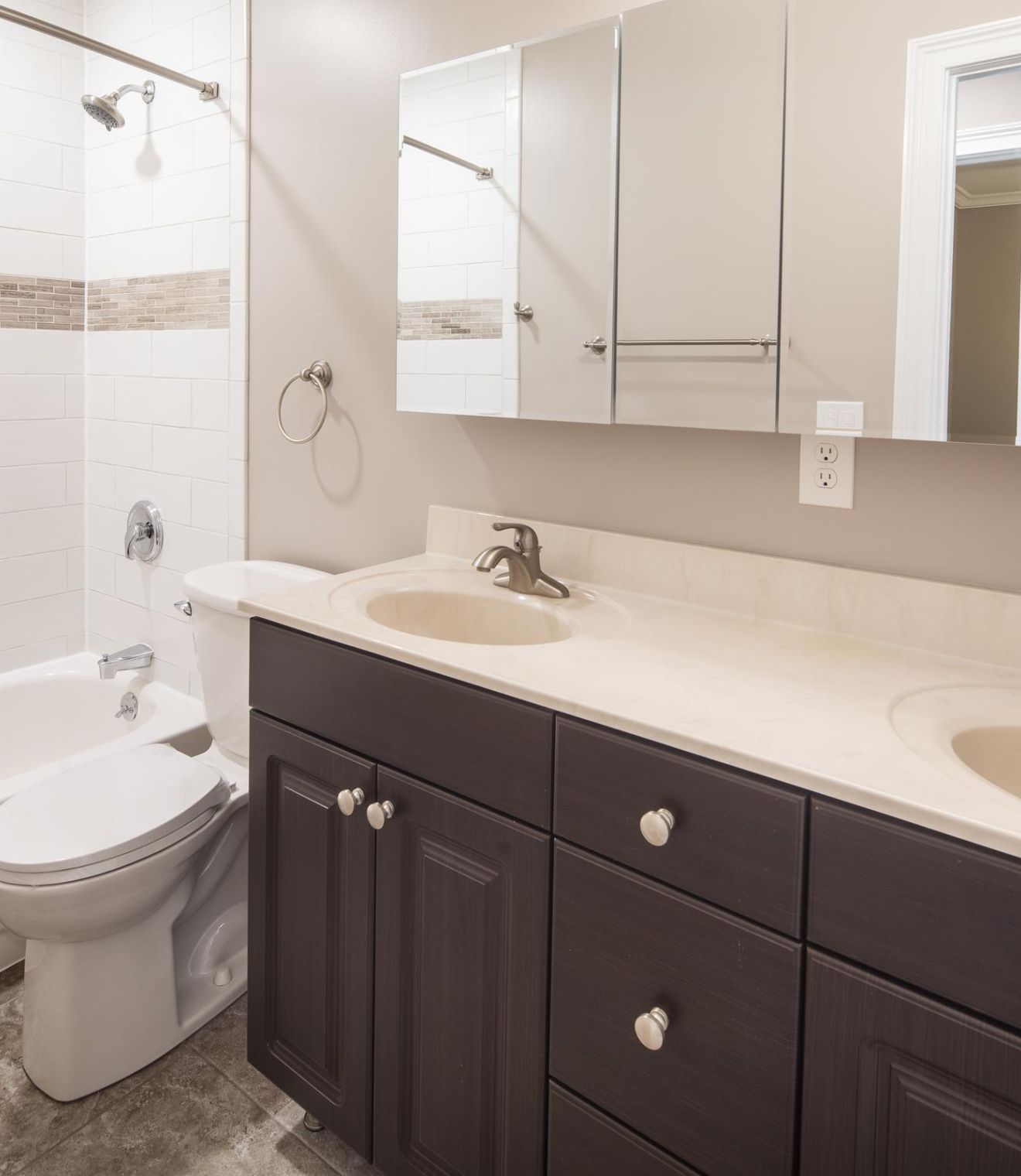 Uptown 550 Midrise spacious kitchen with custom cabinetry and stainless steel appliances