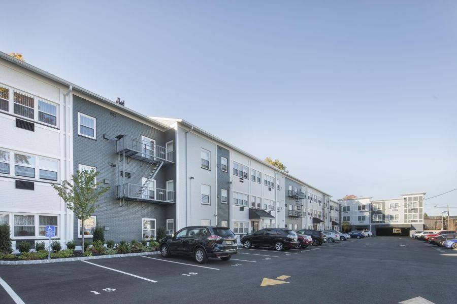 Hickory Manor Small package room with shelves, a bulletin board, and packages on the floor and shelf.