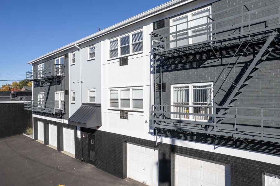 Hickory Manor Small package room with shelves, a bulletin board, and packages on the floor and shelf.