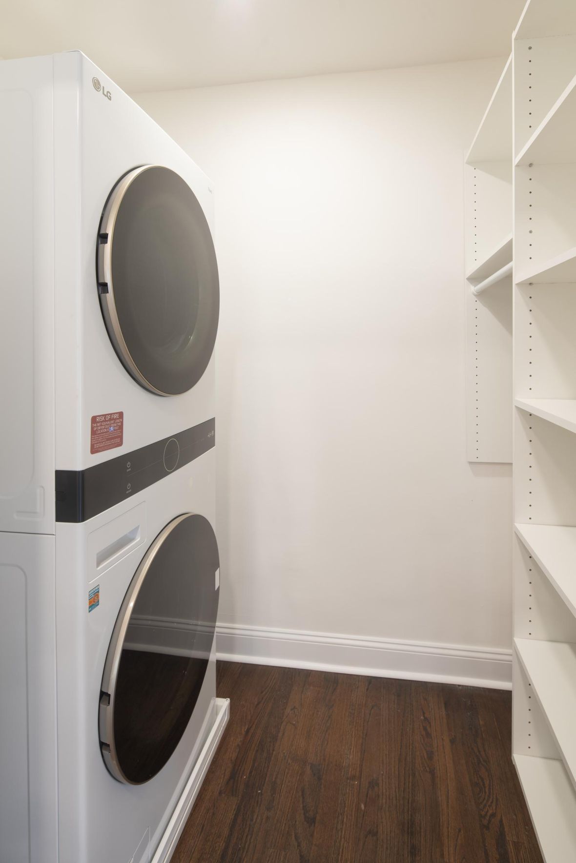 Hickory Manor Modern Minimal Apartment Kitchen with butcher block counters and industrial light fixtures
