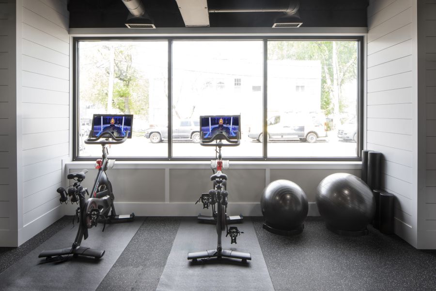 Legion Manor Small package room with shelves, a bulletin board, and packages on the floor and shelf.