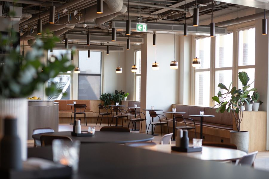 Legion Manor Coffee Shop Cafe with lounge seating, modern lighting, and large windows