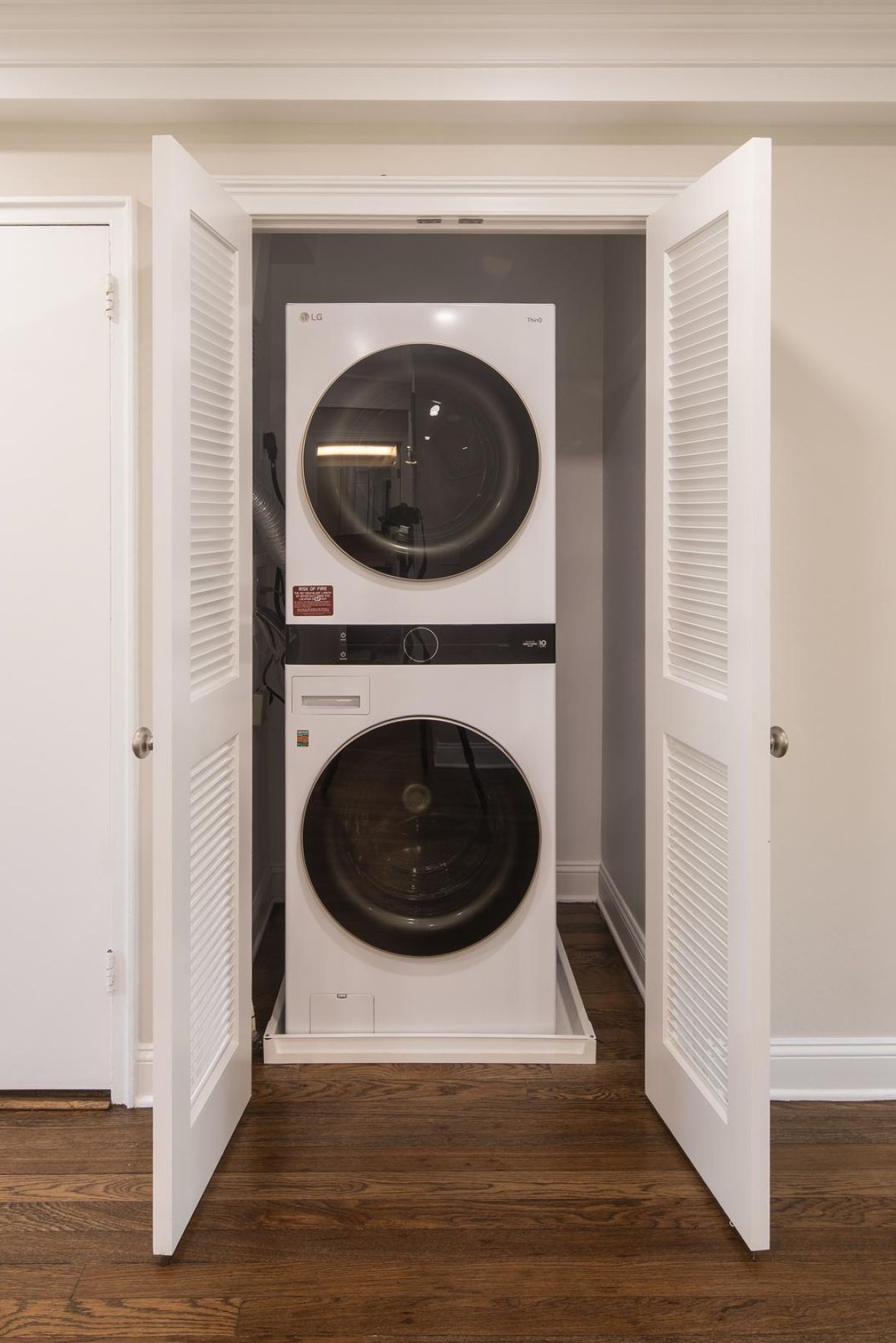 Leonia Manor Modern Minimal Apartment Kitchen with butcher block counters and industrial light fixtures