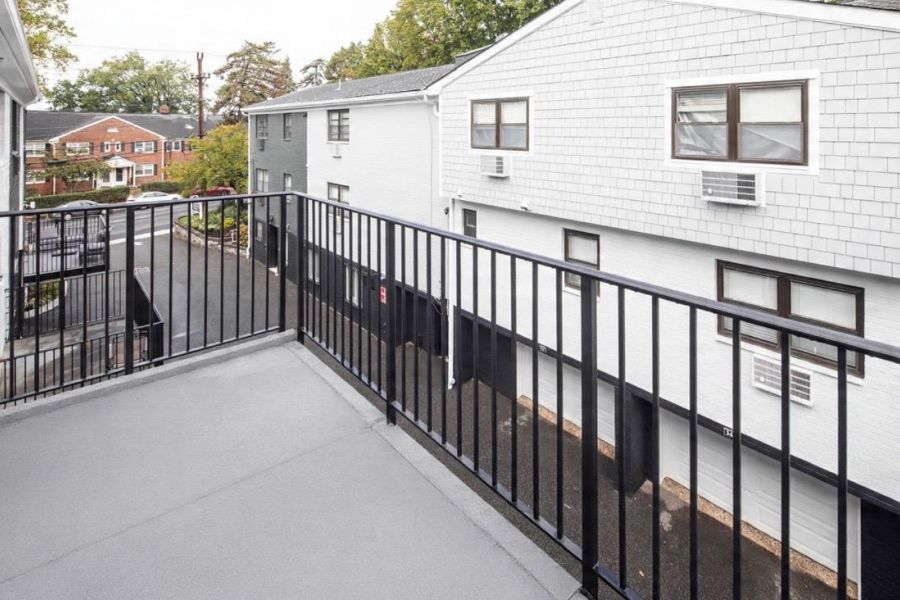 Linden Apartments Modern Spacious Living Room with mid-century furnishings and floor-to-ceiling windows