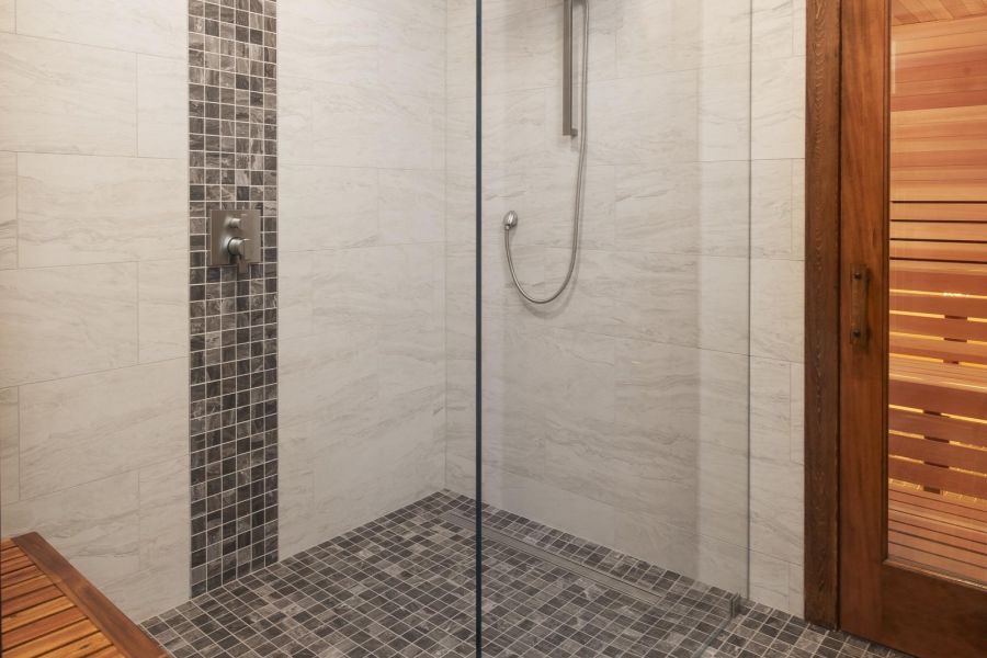 North Washington Square at Hickory Outdoor patio with wooden pergola, cushioned seating, throw pillows, and a round coffee table with drinks.