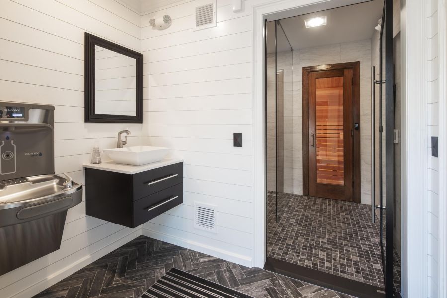 North Washington Square at Hickory Outdoor patio with wooden pergola, cushioned seating, throw pillows, and a round coffee table with drinks.