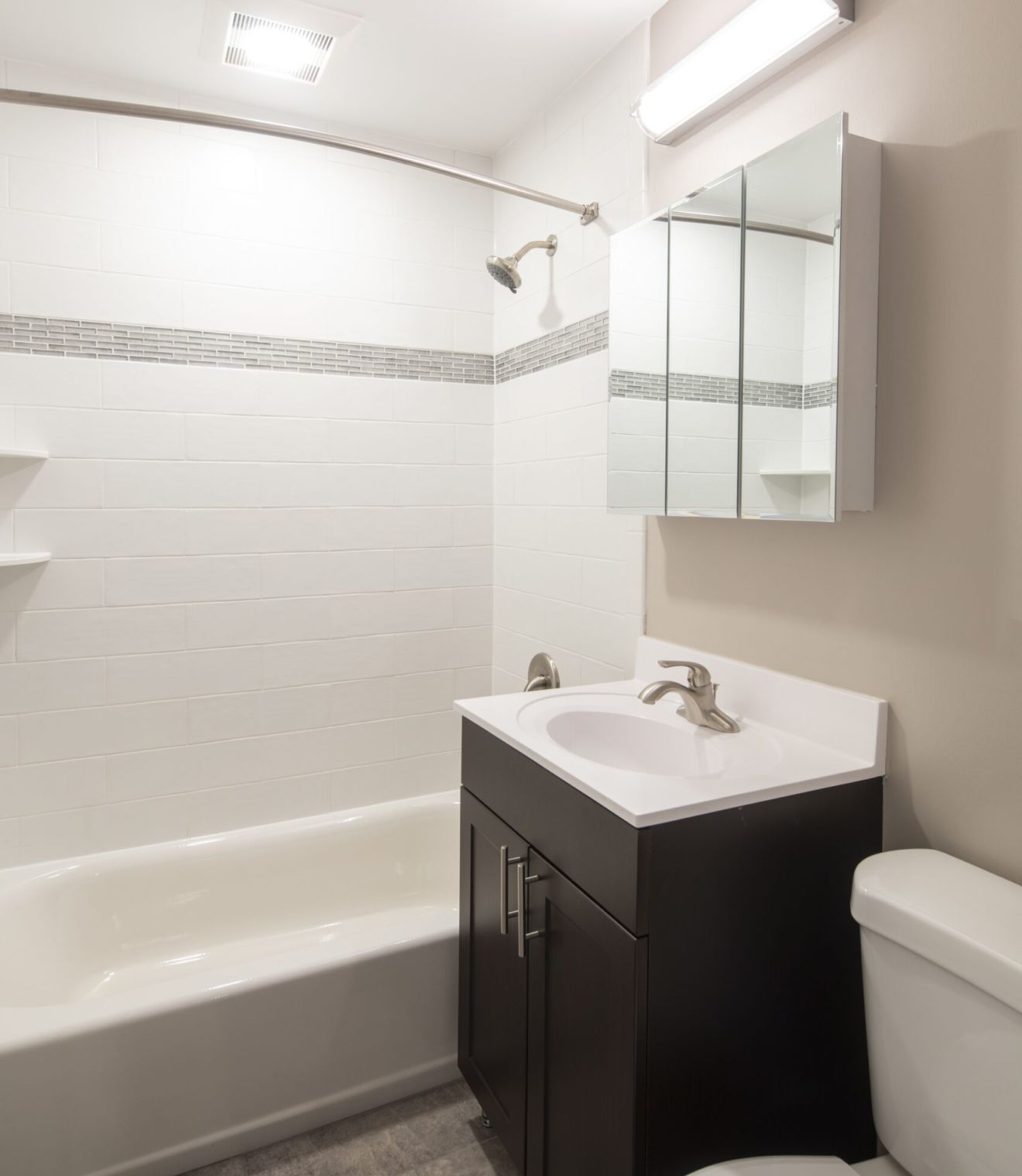 Uptown 550 Midrise spacious kitchen with custom cabinetry and stainless steel appliances