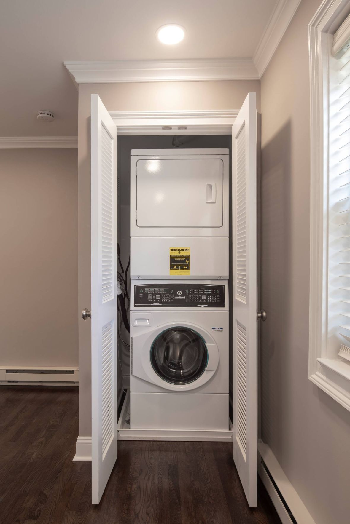 Regency Manor Modern Minimal Apartment Kitchen with butcher block counters and industrial light fixtures