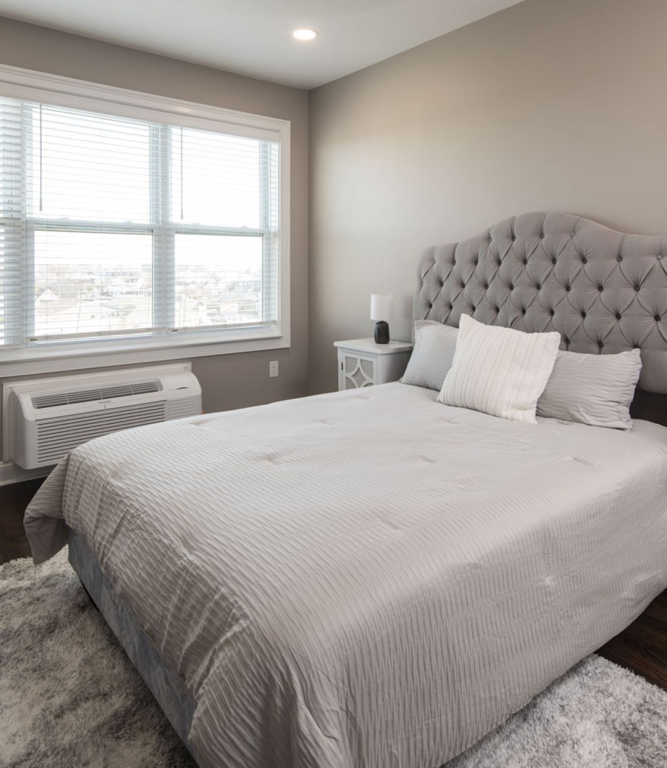 Uptown 550 Midrise spacious kitchen with custom cabinetry and stainless steel appliances