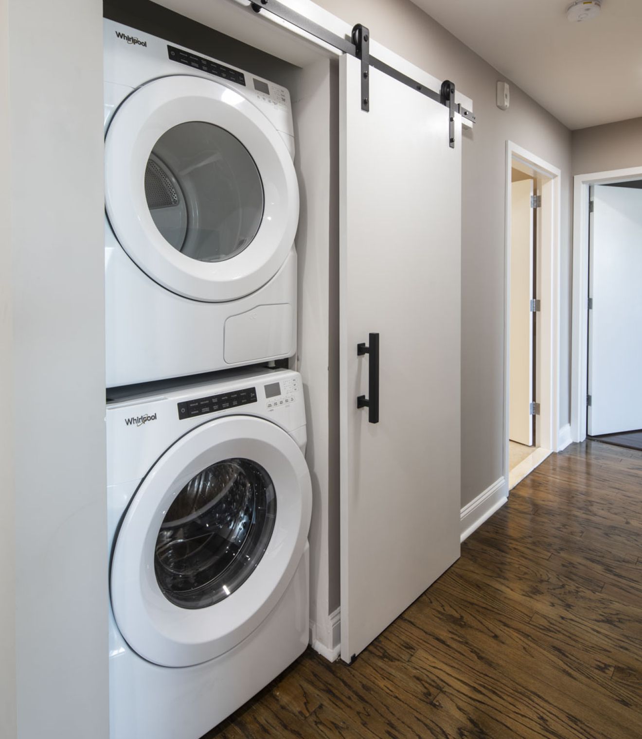 Uptown 550 Midrise spacious kitchen with custom cabinetry and stainless steel appliances