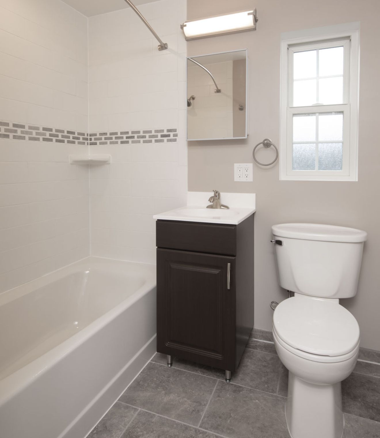 Uptown 550 Midrise spacious kitchen with custom cabinetry and stainless steel appliances