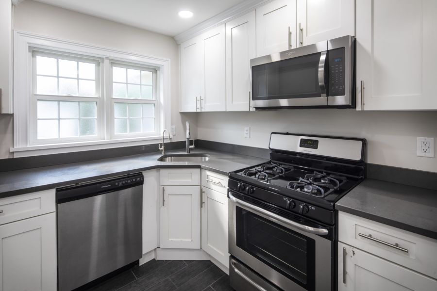 The East Hill Modern Minimal Bathroom with Tub and Sink