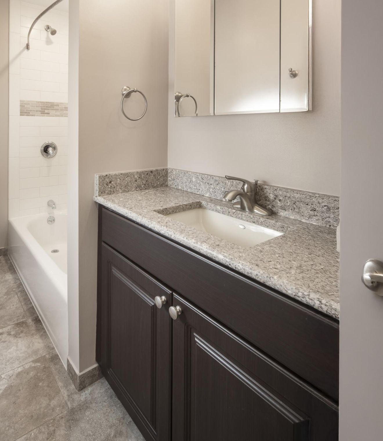 Uptown 550 Midrise spacious kitchen with custom cabinetry and stainless steel appliances