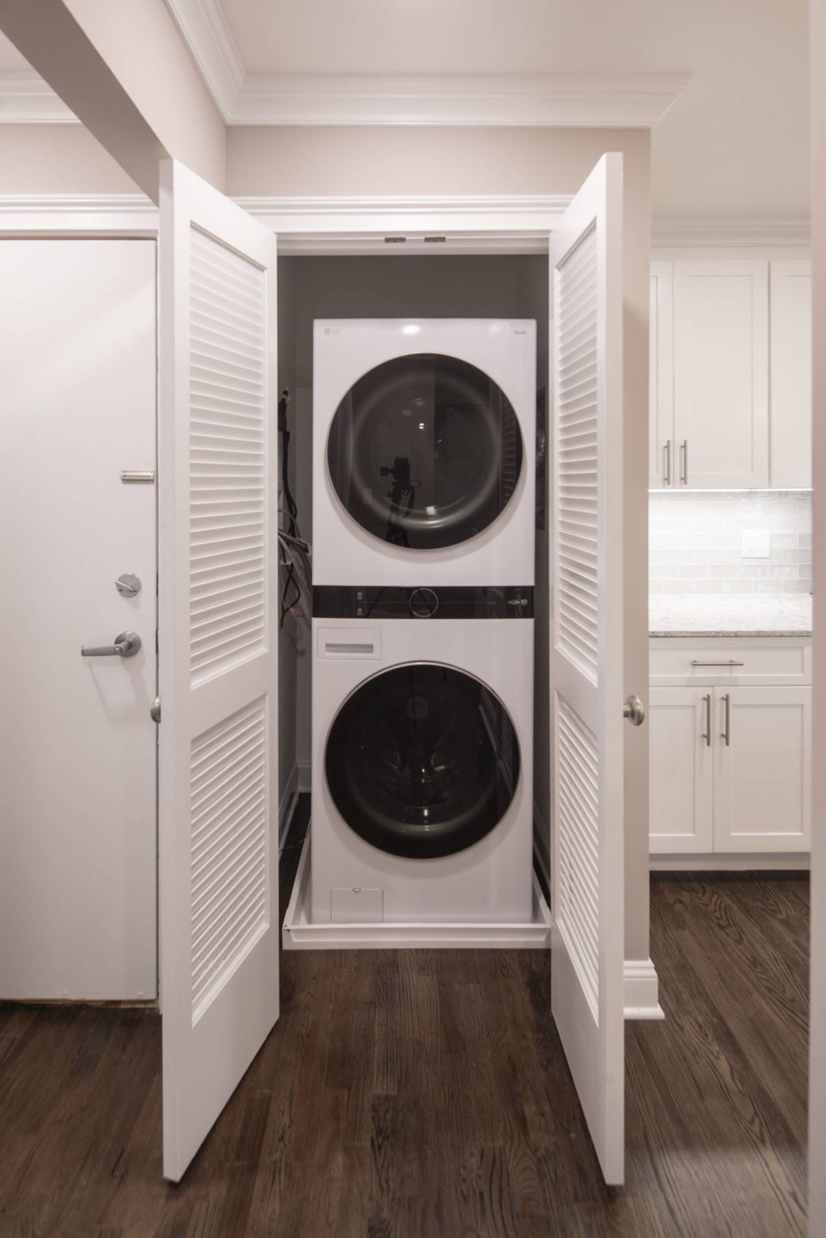Westwood Manor Modern Minimal Apartment Kitchen with butcher block counters and industrial light fixtures