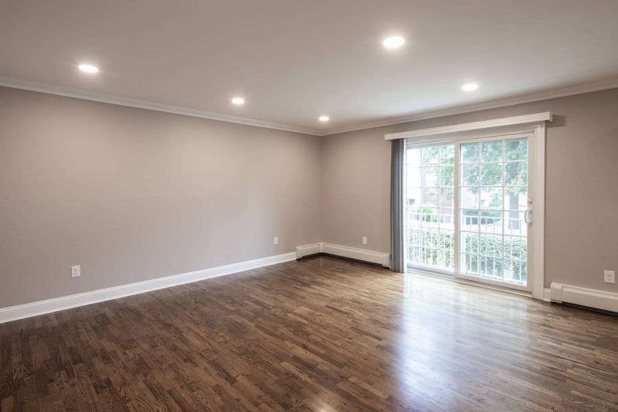 Westwood Manor Modern Spacious Living Room with mid-century furnishings and floor-to-ceiling windows