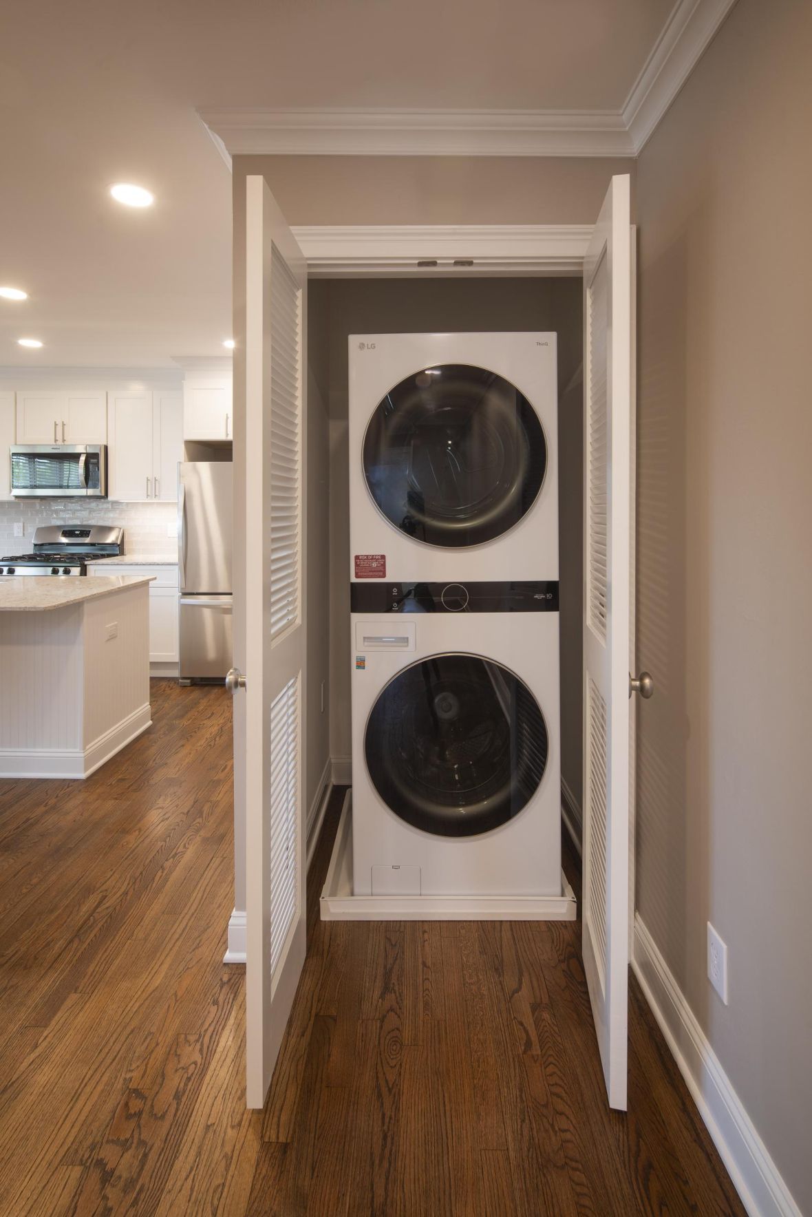 Woodland Hills Manor Modern Minimal Apartment Kitchen with butcher block counters and industrial light fixtures