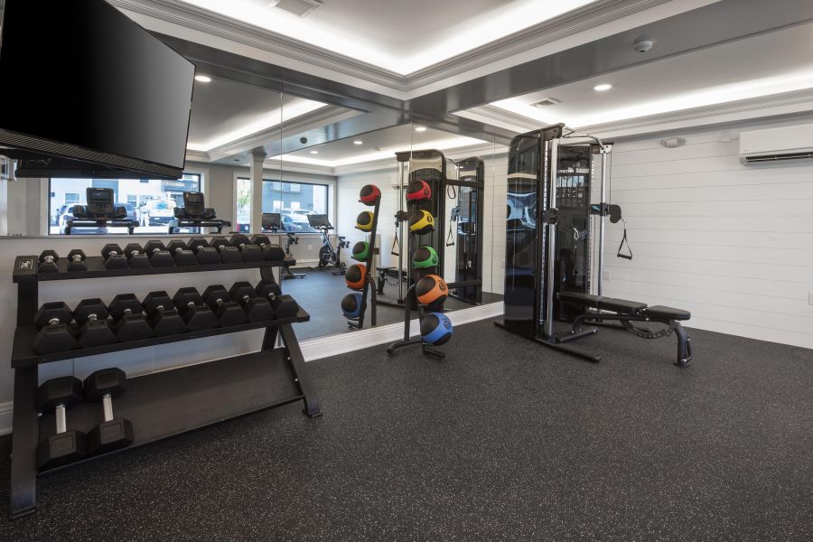 Ridgetop A gym with equipment and a mirror.